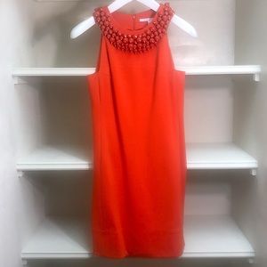 An orange red Diane Von Furstenberg evening dress